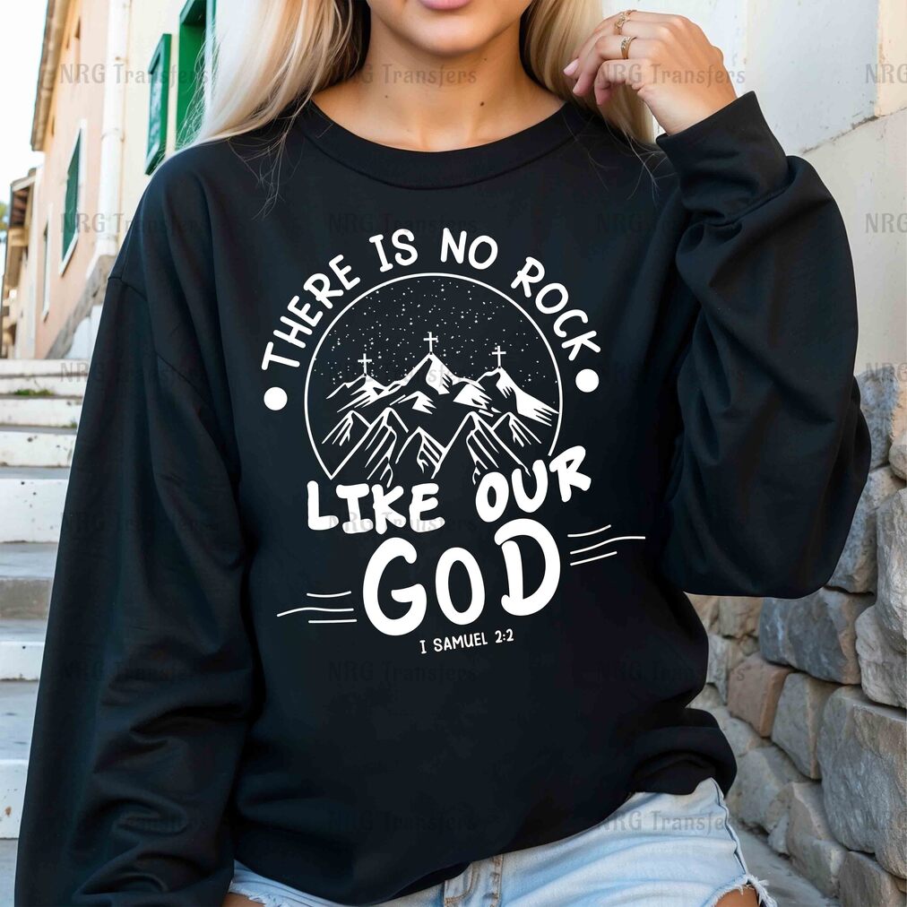 a woman wearing a black sweatshirt that says, there is no rock like our god