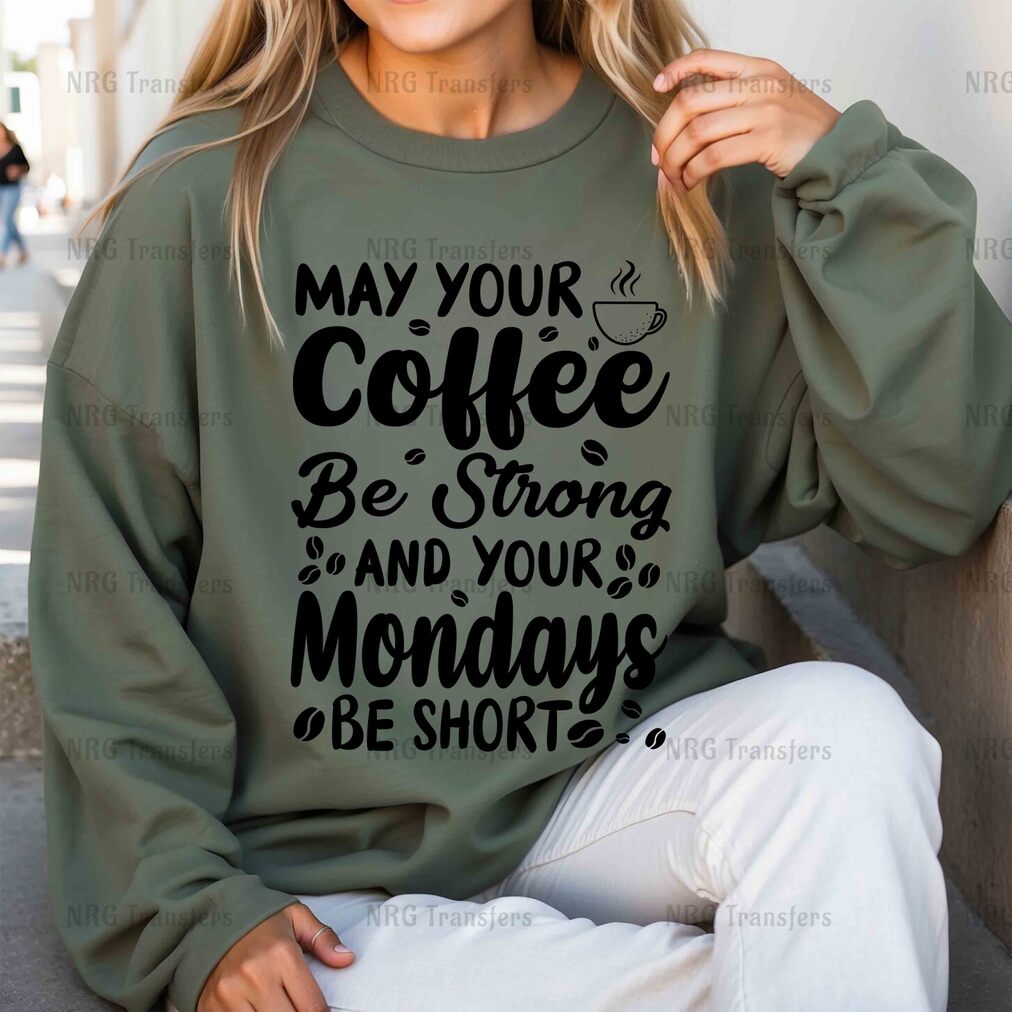 a woman wearing a sweatshirt that says may your coffee be strong and your mondays