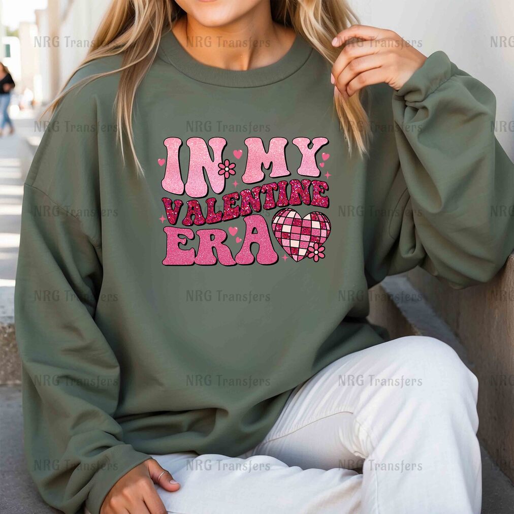 a woman wearing a sweatshirt that says in my valentine era