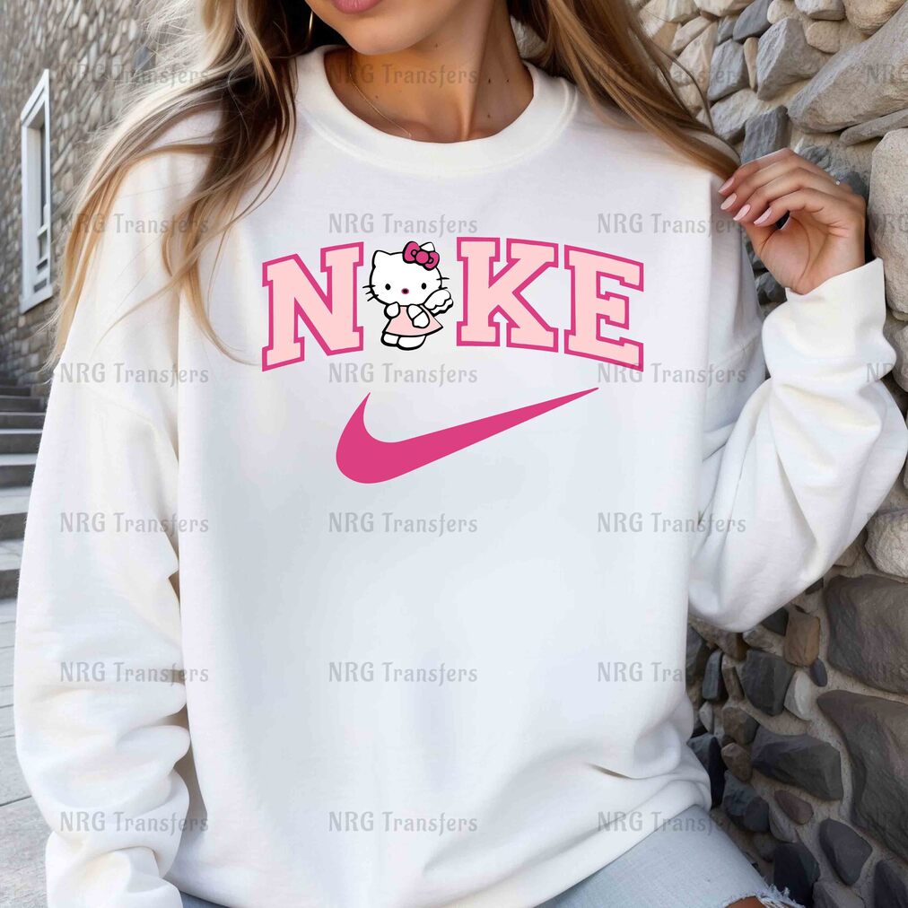 a woman wearing a sweatshirt with a hello kitty on it