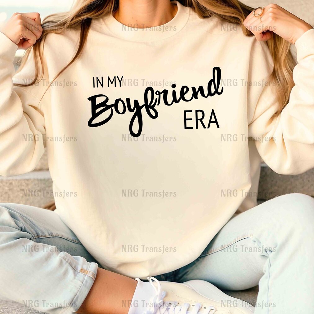 a woman wearing a sweatshirt that says, in my boyfriend era