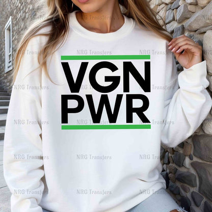 a woman wearing a sweatshirt that says vgn pwr