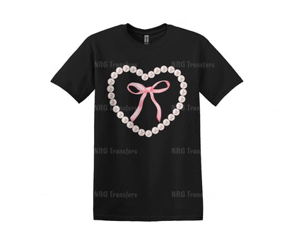 a black t - shirt with a pink bow and pearls in the shape of a