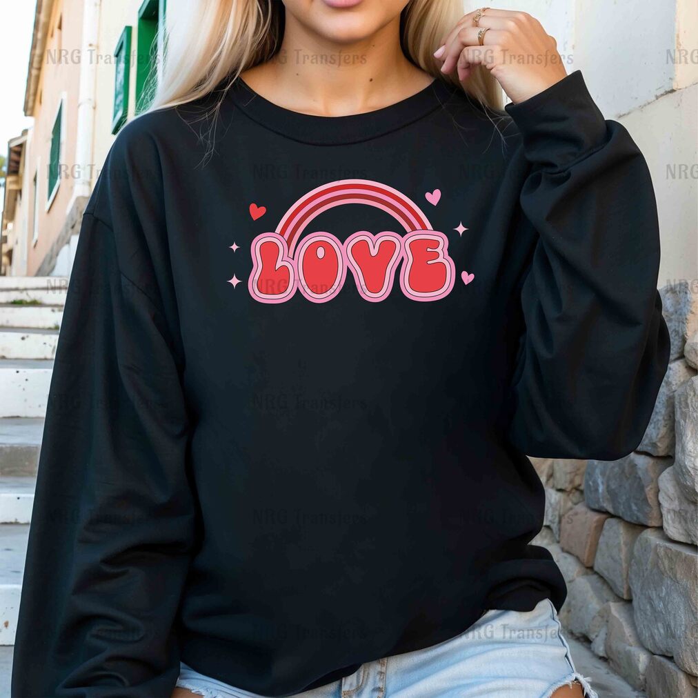 a woman wearing a black sweatshirt with the word love on it