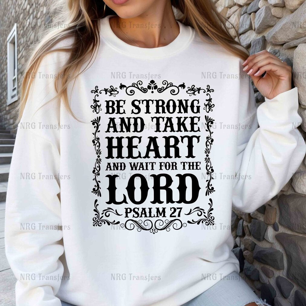 a woman wearing a sweatshirt that says be strong and take heart and wait for the