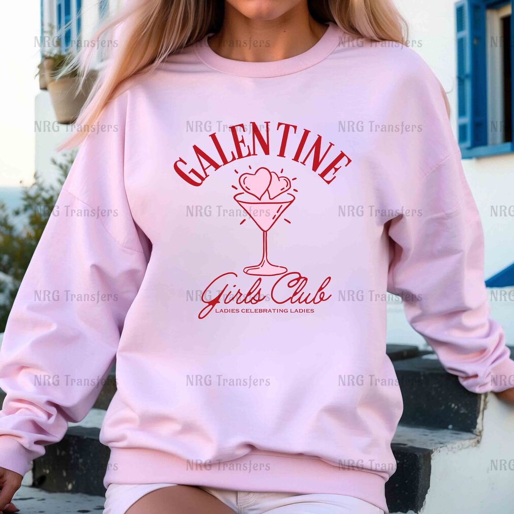 a woman wearing a pink sweatshirt with the word valentine's girl on it